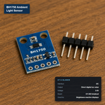 BH1750 ambient light sensor module (GY-302) with a black integrated circuit on a blue PCB, next to five 2-pin header pins, labeled with its at-a-glance specs: I2C interface, direct digital lux output, 3-5V.