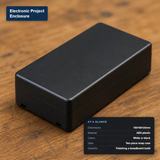 Black 100×60×25mm ABS plastic two-piece project enclosure box, closed.