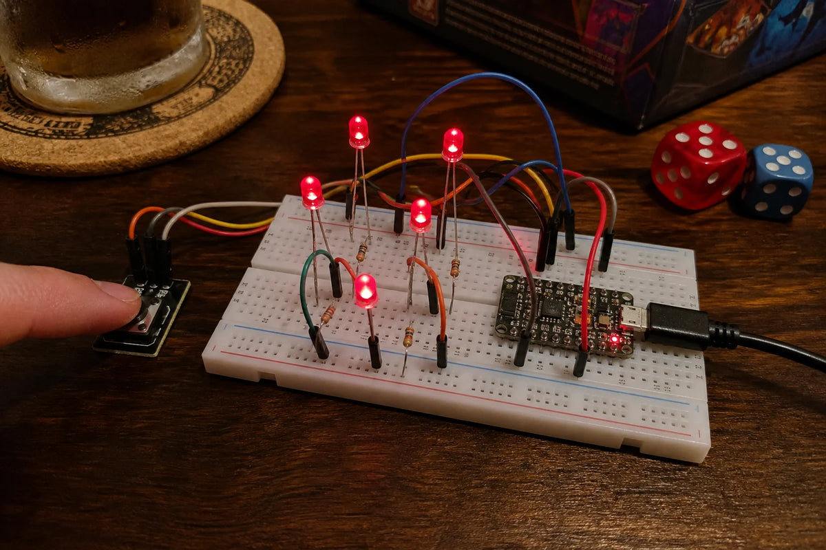 Breadboard with five individual LEDs lit in a dice-face pattern and a push button, ESP32-C3 SuperMini, game night table