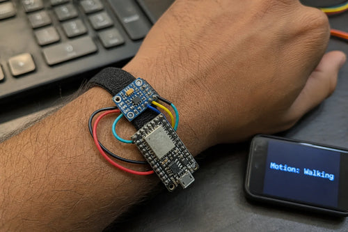 TinyML motion classifier with ESP32-C3 SuperMini and MPU6050 sensor strapped to a wrist, showing motion classification