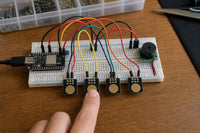 Capacitive touch piano breadboard build with ESP32-C3 SuperMini, TTP223 touch sensor modules as keys, and buzzer