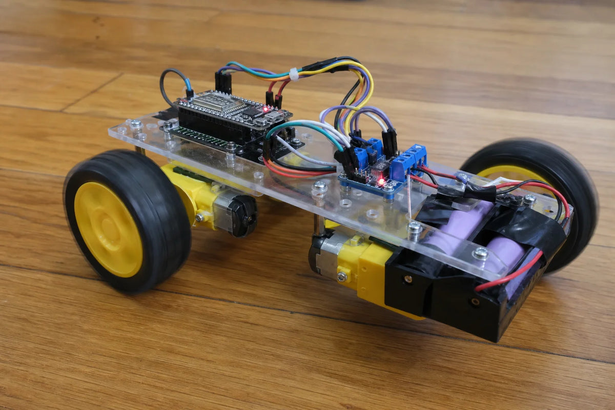 DIY 2WD robot car chassis kit with yellow TT gear motors, wheels, battery box, ESP32-S3 and TB6612FNG driver