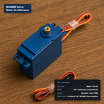Blue MG996R continuous-rotation servo motor with a 3-wire PWM connector, labeled with its at-a-glance specs.
